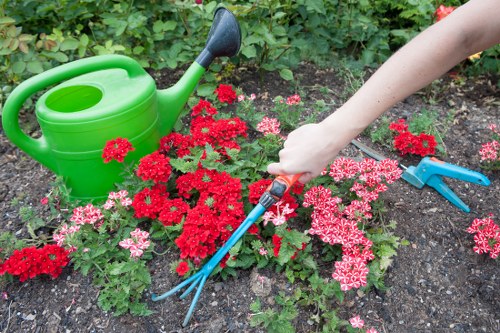 Team of gardeners preparing tools at start of shift