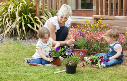 Photograph of gardeners working in a Sanderstead garden, representing commitment to fair labour.